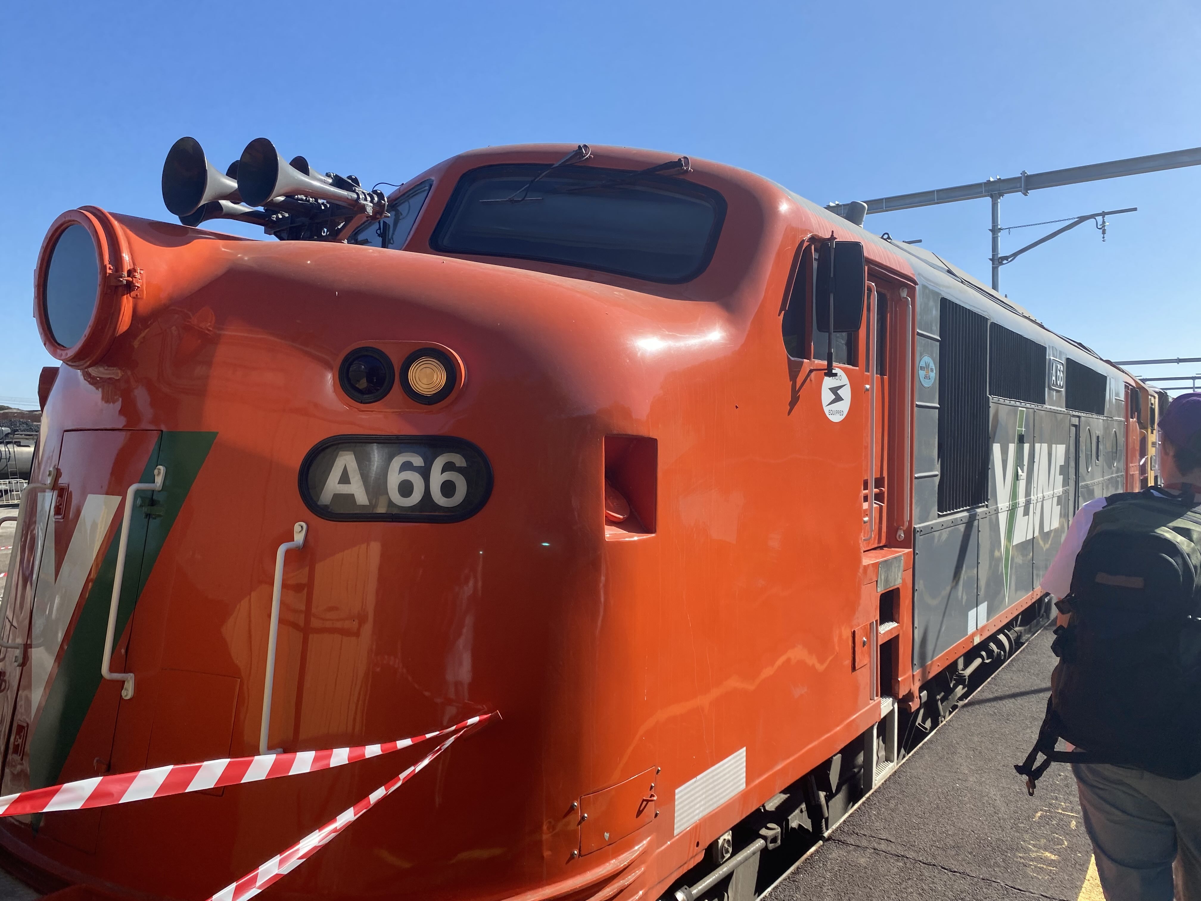 A66 at the garden platform in VLine Orange and Gray livery